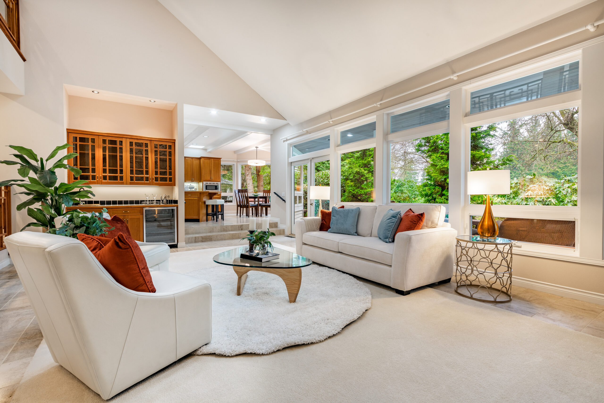 Living room toward wet bar and kitchen