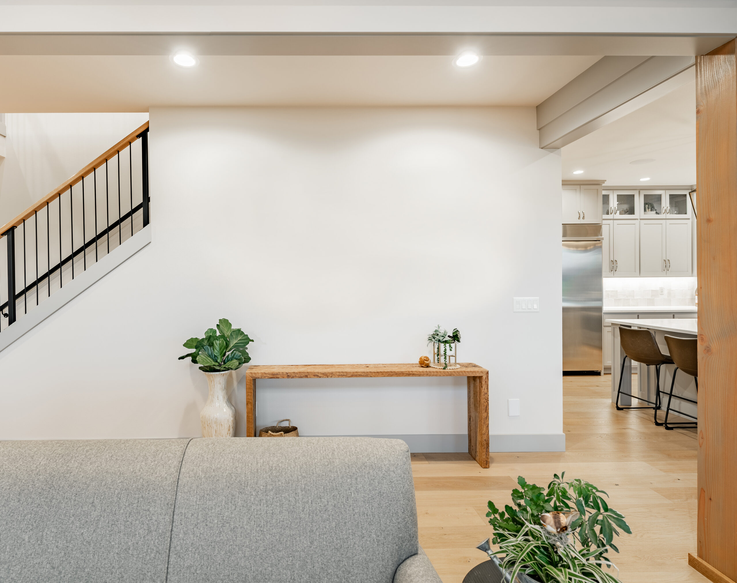Living area and staircase toward kitchen